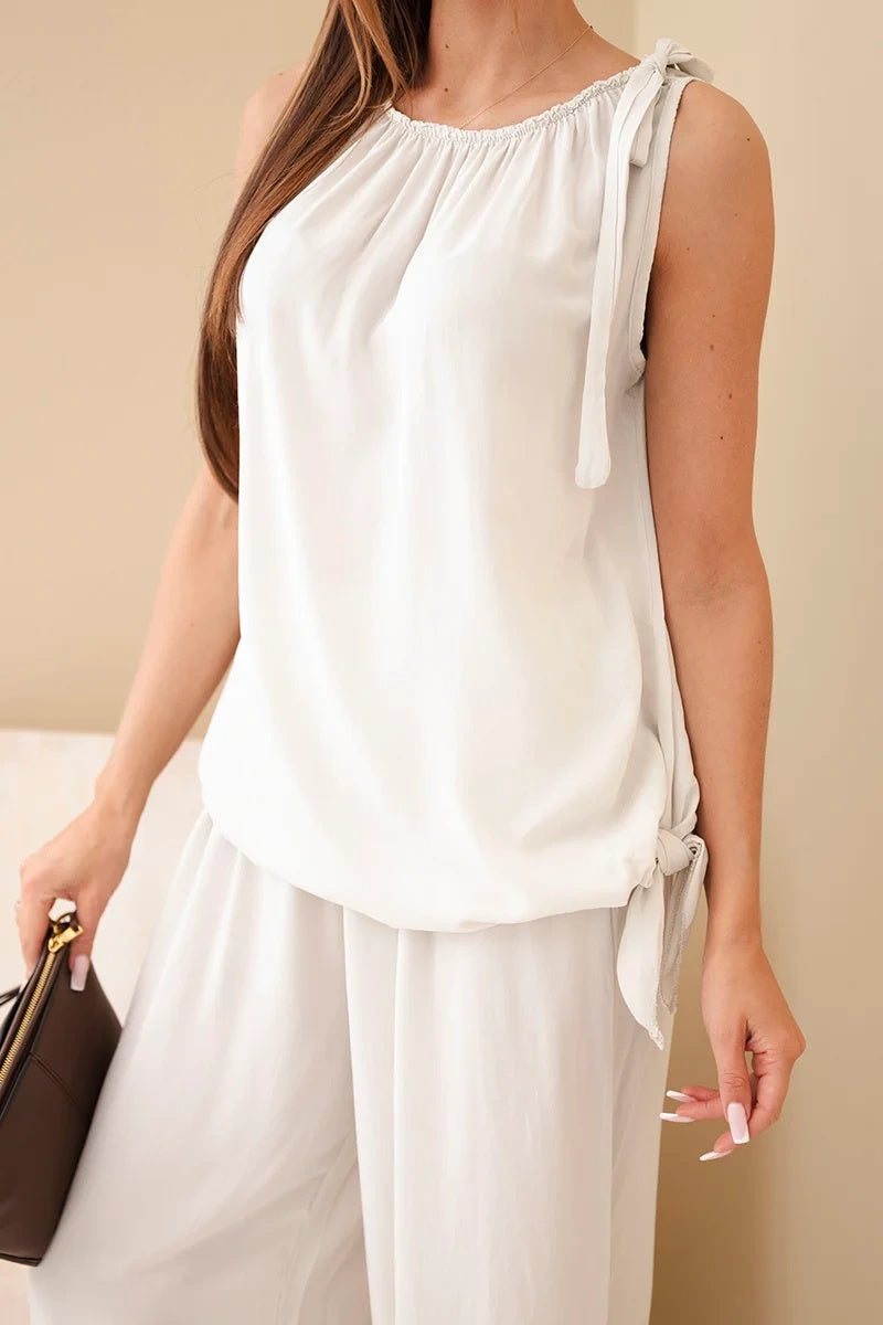 Комплект с асиметрична блуза и широки панталони